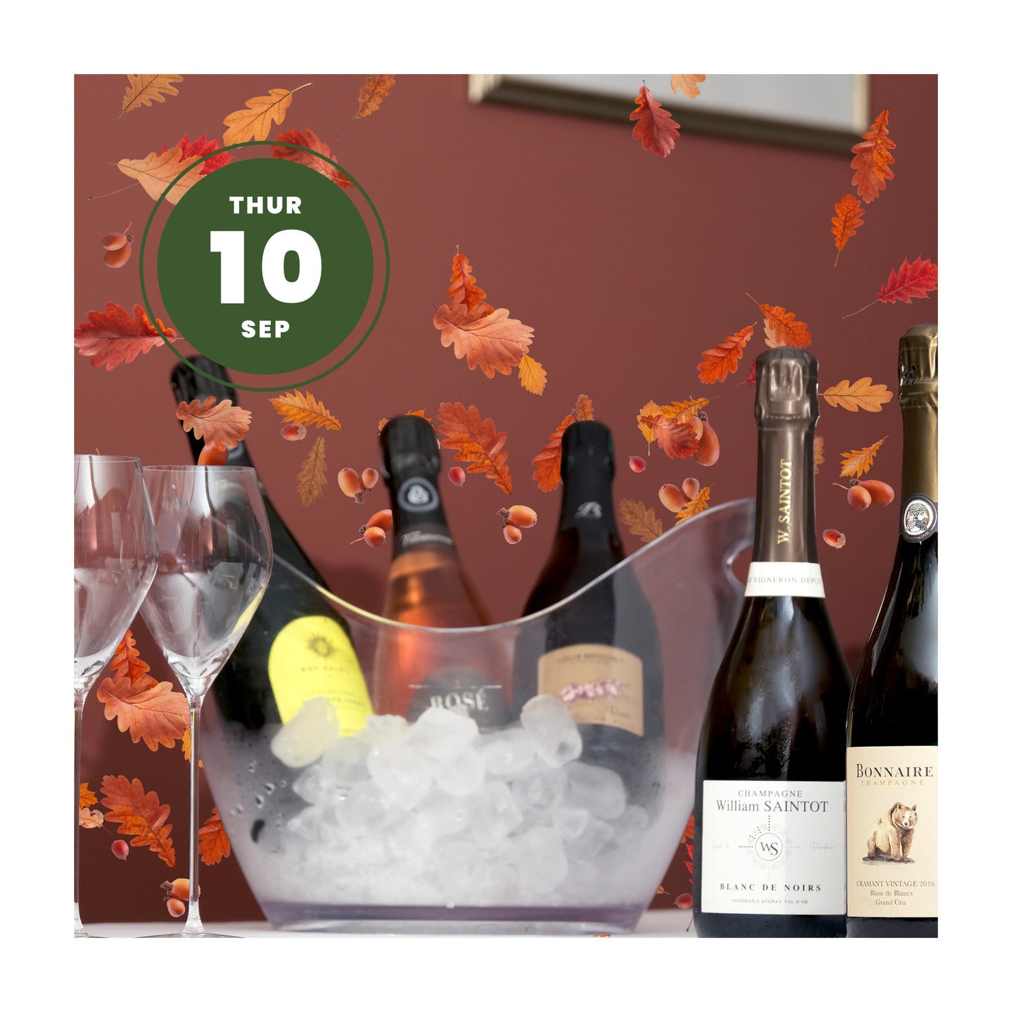 Champagne bottles in an ice bucket with autumn leaves