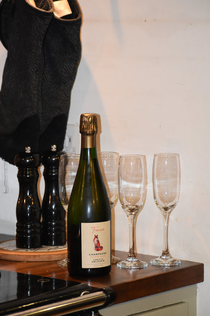 Champagne bottle next to stove in kitchen