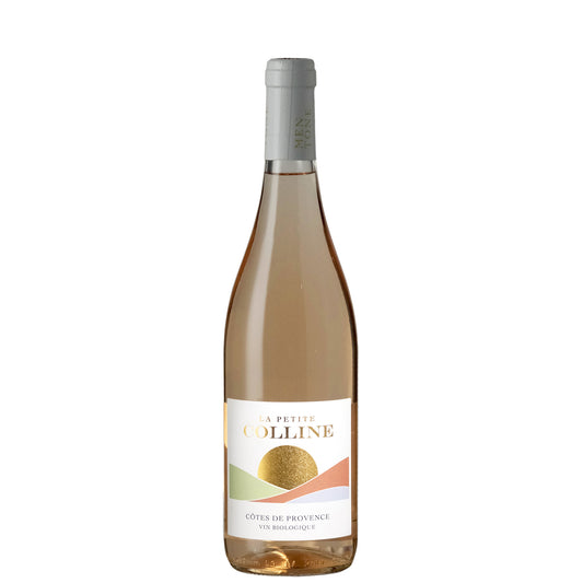 A bottle of La Petite Colline Côte de Provence rosé wine, showing the pale pinkish-cream color of the wine through the glass, with a white label and silver foil cap, isolated on a white background.