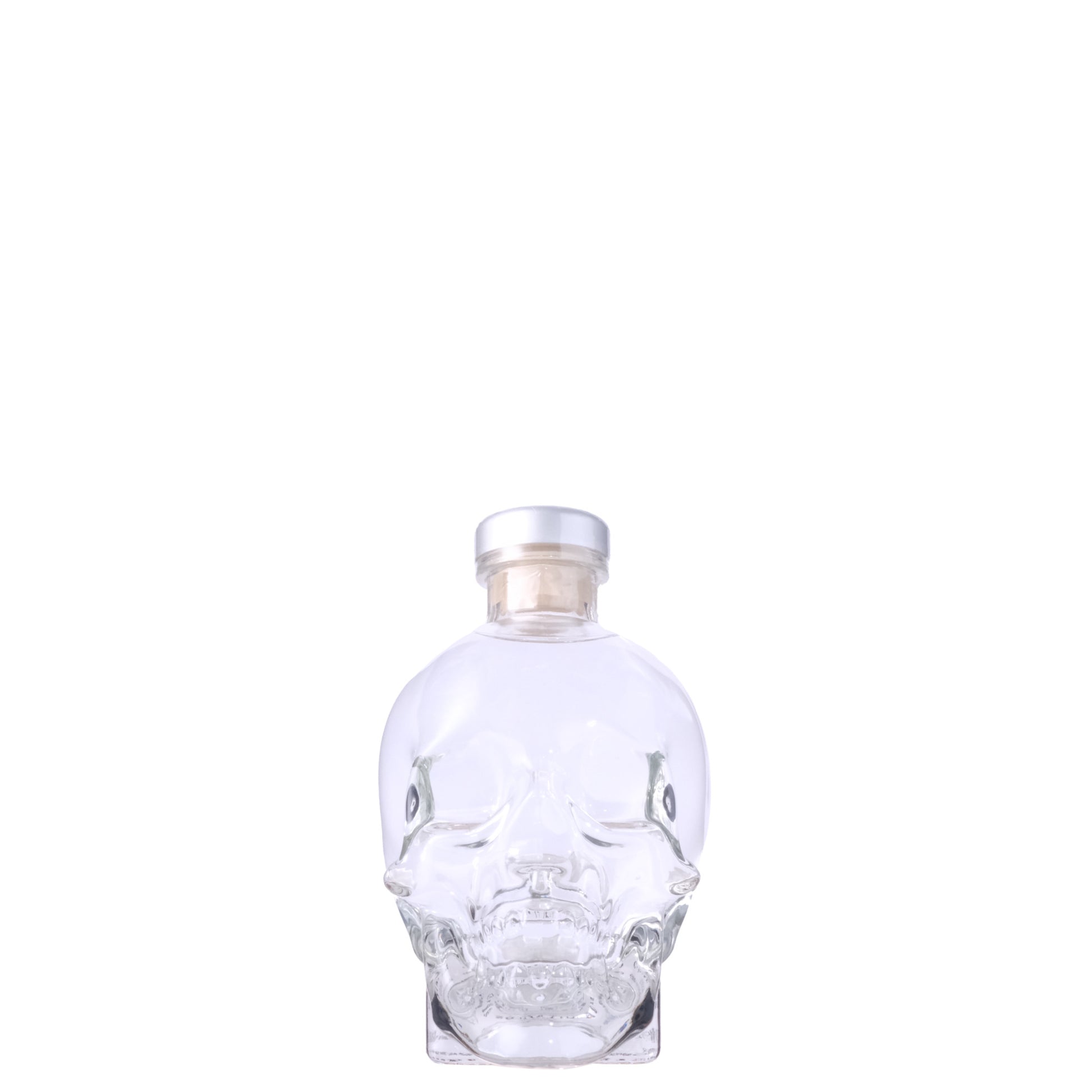 Crystal Head Vodka Bottle, shaped like a skull, on a White Background